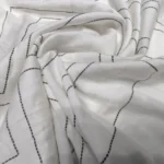 woman wearing white geometric patterned co ord set (1)