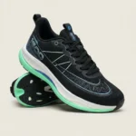 Black athletic running shoe with white midsole and mint green outsole (1)