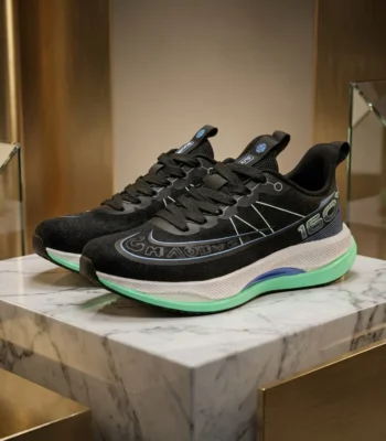 Black athletic running shoe with white midsole and mint green outsole (3)