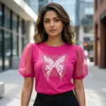 Fuchsia pink women's top with sheer puff sleeves and floral butterfly graphic (3)