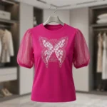 Fuchsia pink women's top with sheer puff sleeves and floral butterfly graphic (4)