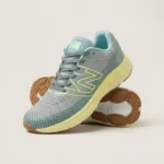 Grey and neon yellow mens running shoes with a chunky sole and N logo (3)