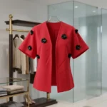 Indian woman modeling a red V neck top with 3D black floral appliqués (9)