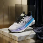 Poly Armor gradient mesh running shoes in blue and purple on a marble display block (1)
