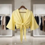Women wearing a pastel yellow linen tie front short shrug top with wide bell sleeves (2)