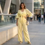 Women wearing a pastel yellow linen tie front short shrug top with wide bell sleeves (4)