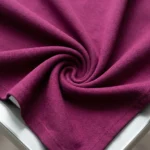 a plum tailored asymmetric vest top with large gold buttons (1)