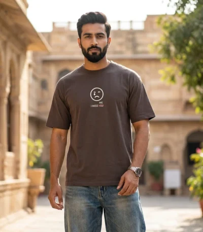 man wearing a brown oversized graphic printed t shirt (1)