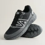 mens black mesh running shoe with thick grey textured sole and white side logo (2)