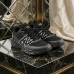 mens black mesh running shoe with thick grey textured sole and white side logo (3)
