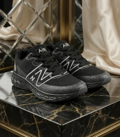mens black mesh running shoe with thick grey textured sole and white side logo (3)