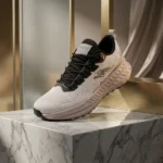 pair of Street Time white knitted mens running sneakers with black laces resting (1)