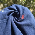 premium navy blue polo t shirt with a red logo on the chest (4)