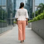 white round neck peplum top with peach polka dots and a smocked bodice (2)