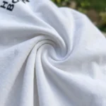 white t shirt with a large black shipping label graphic and Human Being text (4)
