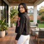 Women wearing a black crop shirt with pink beaded bow design (2)