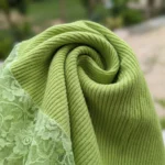 Womens lime green ribbed knit top with lace sleeves and mock neck (3)
