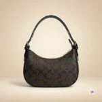 Coach shoulder bag is an iconic accessory featuring signature monogram print and refined black leather trim. – Classy coach shoulder bag – photo 4
