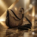 Coach shoulder bag is an iconic accessory featuring signature monogram print and refined black leather trim. – Classy coach shoulder bag – photo 5