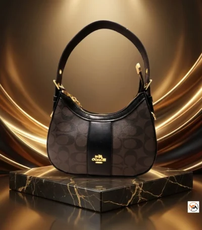 Coach shoulder bag is an iconic brown accessory featuring dark trim and gold hardware – coach shoulder bag – photo 1