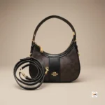 Coach shoulder bag is an iconic brown accessory featuring dark trim and gold hardware – coach shoulder bag – photo 2