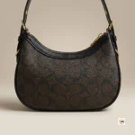 Coach shoulder bag is an iconic brown accessory featuring dark trim and gold hardware – coach shoulder bag – photo 3