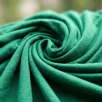 Essential green top for women featuring an elegant front twist detail and classic short sleeves – green top for women – photo 4