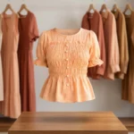 peach smocked peplum top with puff sleeves and pearl buttons (1)
