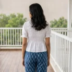 white smocked peplum top with short puff sleeves and a collar (1)