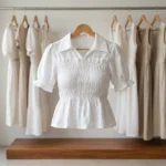 white smocked peplum top with short puff sleeves and a collar (2)