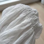 white smocked peplum top with short puff sleeves and a collar (3)