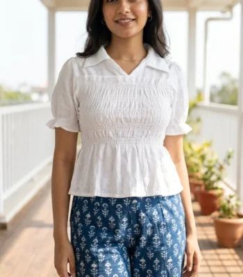 white smocked peplum top with short puff sleeves and a collar (4)